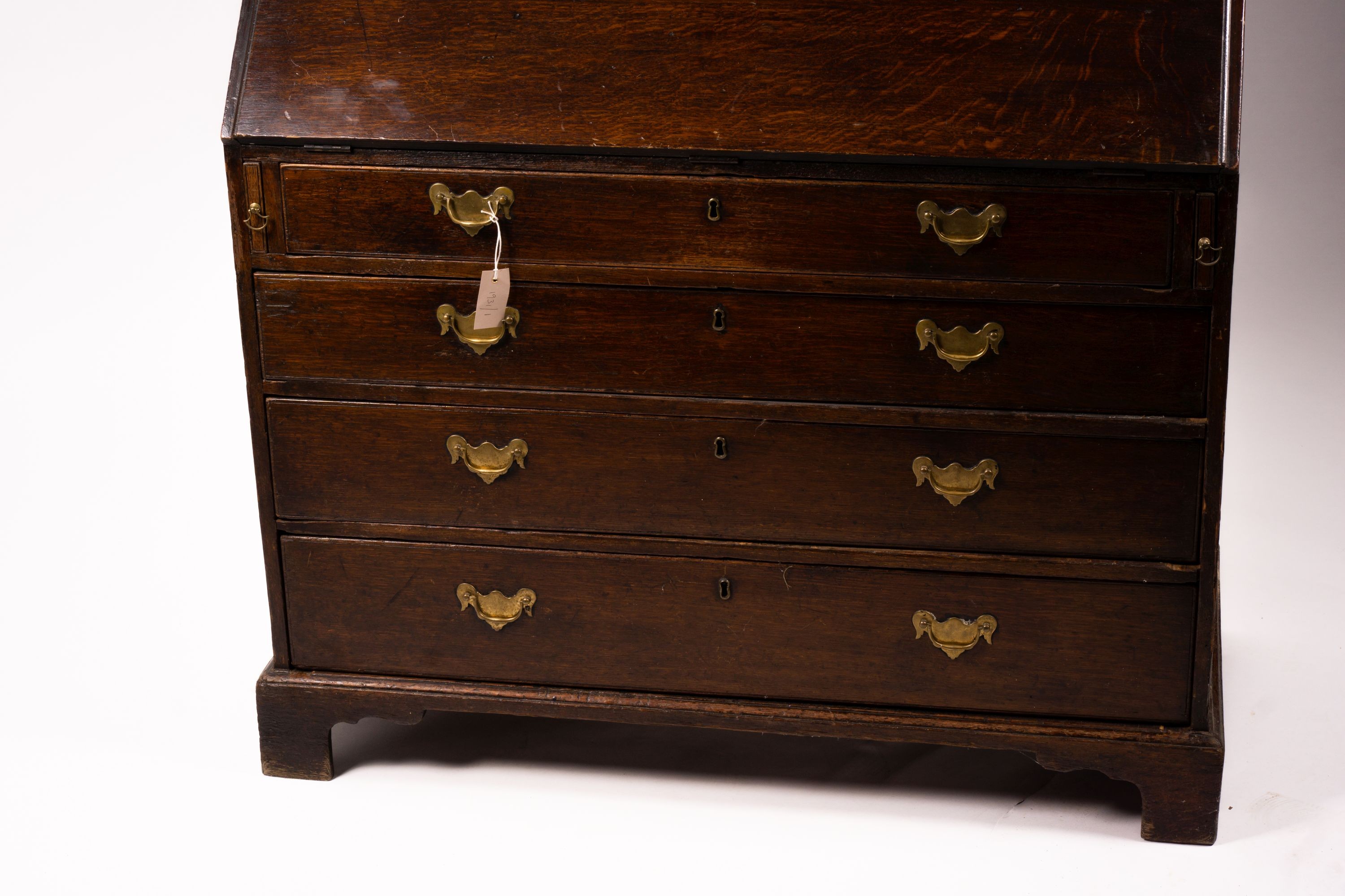 A George III oak bureau cabinet, width 108cm, depth 52cm, height 209cm